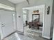 Inviting dining room featuring elegant lighting and an adjacent front entryway at 1034 Se 65Th Cir, Ocala, FL 34472