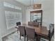 Formal dining area with stylish lighting fixture and a display cabinet at 1034 Se 65Th Cir, Ocala, FL 34472