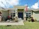 Welcoming front entrance with tasteful landscaping, creating an inviting first impression for visitors at 1034 Se 65Th Cir, Ocala, FL 34472