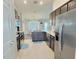 Beautiful kitchen with stainless appliances, granite countertops, and views of the dining area and backyard at 1034 Se 65Th Cir, Ocala, FL 34472