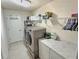 Laundry room with a washer and dryer, tile floors, and storage at 1034 Se 65Th Cir, Ocala, FL 34472