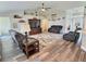 Cozy living room with vaulted ceilings, ceiling fan, and stylish decor at 1034 Se 65Th Cir, Ocala, FL 34472