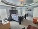 Comfortable main bedroom featuring a ceiling fan, natural light, and plenty of space for relaxation at 1034 Se 65Th Cir, Ocala, FL 34472