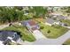 Aerial view of home with screened pool, fenced yard, outbuildings and large front lawn at 10910 Sw 47Th Ct, Ocala, FL 34476