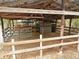 Wooden barn with stalls and fenced areas at 1370 Nw 120Th Ave, Ocala, FL 34482