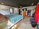 Bedroom featuring wooden floors, a king bed, and modern black ceiling at 1370 Nw 120Th Ave, Ocala, FL 34482