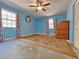 This bedroom features two windows, a ceiling fan, and an area rug at 1370 Nw 120Th Ave, Ocala, FL 34482