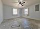 Bedroom features two windows and a ceiling fan at 1370 Nw 120Th Ave, Ocala, FL 34482