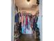 Walk-in closet with shelving, hanging racks, and plenty of storage space for clothes and shoes at 1370 Nw 120Th Ave, Ocala, FL 34482