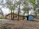 Home exterior shows the structure, siding, and some of the yard and trees at 1370 Nw 120Th Ave, Ocala, FL 34482