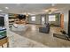 Open living room featuring a unique wood accent wall, spacious seating, and abundant natural light at 1370 Nw 120Th Ave, Ocala, FL 34482