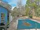 Pool area featuring a covered pool, patio, and surrounding landscape at 1370 Nw 120Th Ave, Ocala, FL 34482