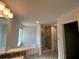 A bathroom featuring a separate shower, bathtub, and natural light at 4397 Sw 90Th Pl, Ocala, FL 34476