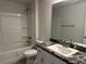 Bathroom with single vanity, tub/shower combo, and a modern toilet at 4397 Sw 90Th Pl, Ocala, FL 34476