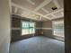 Bedroom with a grid-pattern ceiling and natural light filtering through the double windows at 4397 Sw 90Th Pl, Ocala, FL 34476