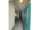 Inviting entryway with a light teal door, ceramic tile flooring and a view into the house at 4397 Sw 90Th Pl, Ocala, FL 34476