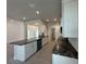 Spacious kitchen with granite countertops, stainless appliances and white cabinetry at 4397 Sw 90Th Pl, Ocala, FL 34476