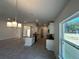 Open-concept kitchen featuring white cabinets, granite countertops, recessed lights, and ceramic tile floors at 4397 Sw 90Th Pl, Ocala, FL 34476