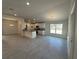 Modern kitchen with granite countertops, white cabinetry, and stainless steel appliances at 4397 Sw 90Th Pl, Ocala, FL 34476