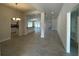 Open-concept living space with ceramic tile flooring, recessed lighting and a dining area off the kitchen at 4397 Sw 90Th Pl, Ocala, FL 34476
