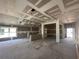 Open-concept living room with large windows, prepped for finishing touches at 4397 Sw 90Th Pl, Ocala, FL 34476