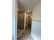 New tiled shower with a glass door and a view into the water closet at 4397 Sw 90Th Pl, Ocala, FL 34476