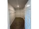 Walk-in closet featuring carpet, white walls, and wire shelving for organized storage solutions at 4397 Sw 90Th Pl, Ocala, FL 34476