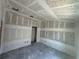 Spacious bedroom ready for customization with raw walls and wiring set for personalization at 4413 Sw 90Th Pl, Ocala, FL 34476