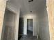 Hallway with doorways, ready for personalization and customization with raw walls at 4413 Sw 90Th Pl, Ocala, FL 34476