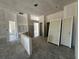 Open-concept living space ready to be transformed, with raw walls and many doorways at 4413 Sw 90Th Pl, Ocala, FL 34476
