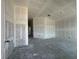 Unfinished living room features drywall and large window views of the exterior at 4413 Sw 90Th Pl, Ocala, FL 34476