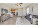 Spacious living room featuring tile floors, comfortable seating, and a view into the modern kitchen at 4749 Nw 39Th Street Rd, Ocala, FL 34482