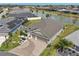 Aerial view of home featuring manicured landscaping and a two-car garage at 5766 Henry Loop, The Villages, FL 32163