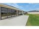 Covered porch overlooking a backyard at 5766 Henry Loop, The Villages, FL 32163