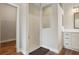 Modern bathroom with a glass-enclosed shower and contemporary vanity with wood-look floors at 5766 Henry Loop, The Villages, FL 32163