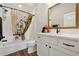 Modern bathroom featuring tile floors, vanity, and shower/tub with decorative curtain at 5766 Henry Loop, The Villages, FL 32163