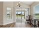 Cozy breakfast nook with lake views, sliding glass doors, and natural light at 5766 Henry Loop, The Villages, FL 32163