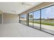 Enclosed patio with views of the backyard, landscaping and waterway at 5766 Henry Loop, The Villages, FL 32163