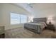 Spacious bedroom with carpet, a ceiling fan, and a large window for natural light at 7014 Elaine Ct, The Villages, FL 34762