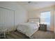 Cozy bedroom featuring neutral decor, closet, and window at 7014 Elaine Ct, The Villages, FL 34762