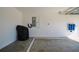 Spacious garage featuring an electrical panel, water filtration system and EV charger at 7014 Elaine Ct, The Villages, FL 34762