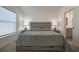 Comfortable main bedroom featuring neutral decor and ensuite bathroom at 7014 Elaine Ct, The Villages, FL 34762