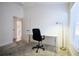 Bright office space includes desk, modern lighting, and neutral color scheme at 7014 Elaine Ct, The Villages, FL 34762