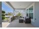 Covered patio space featuring stylish seating, pergola, and decorative plants at 7014 Elaine Ct, The Villages, FL 34762