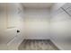 Spacious walk-in closet with carpeted floors and wire shelving provides ample storage at 7014 Elaine Ct, The Villages, FL 34762