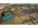 Aerial view of community amenities including tennis courts, pool, and baseball field at 8491 Sw 52Nd Lane Rd, Ocala, FL 34481