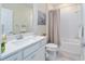 Bathroom with vanity, toilet, bath and shower combination and grey and white tones at 8491 Sw 52Nd Lane Rd, Ocala, FL 34481