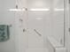 Tiled shower with clear glass door, built-in bench, and shower niche at 8491 Sw 52Nd Lane Rd, Ocala, FL 34481