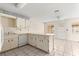 Well-lit kitchen featuring a dishwasher, ample cabinet space, and tile flooring at 8700 Sw 98Th Street Rd # E, Ocala, FL 34481