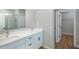 Modern bathroom featuring double sink vanity, quartz countertops, and glass-enclosed shower at 9975 Sw 39Th Ter, Ocala, FL 34476